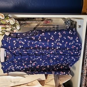 Sleeveless blouse with bow and pleat detail